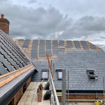 alt="slate roofing new build home"