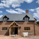 alt="completed new build slate roof"