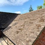alt="clay roof tiles on house extension"