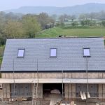 alt="new build slate roof"
